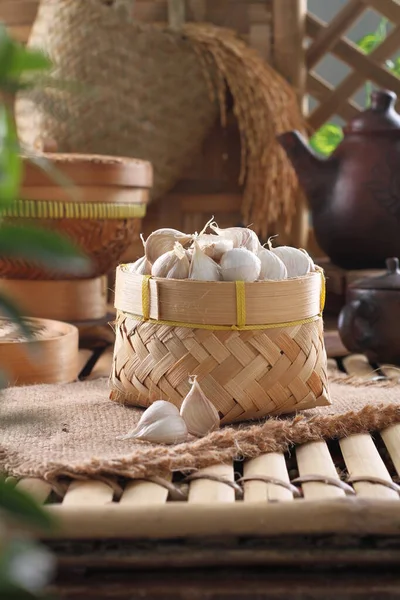 stock image wicker basket with different types of towels and flowers