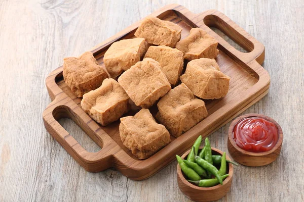 stock image homemade chicken nuggets with sauce and cheese on wooden background