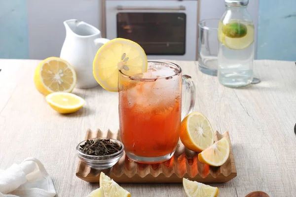 stock image homemade fresh ginger tea, lemon and mint. on a wooden background.