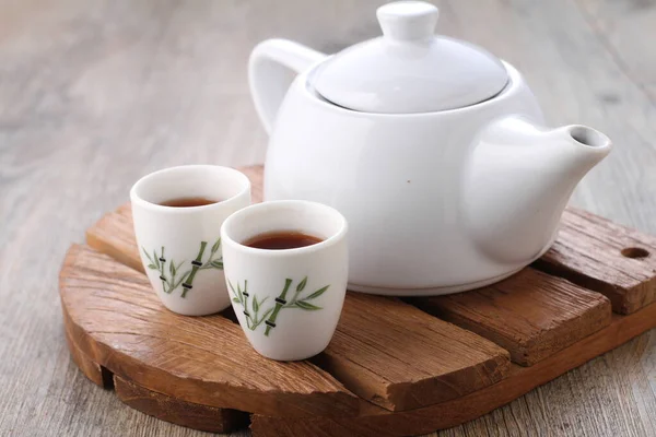 stock image Tea is an aromatic beverage prepared by pouring hot or boiling water over cured or fresh leaves of Camellia sinensis, an evergreen shrub native to East Asia which probably originated in the borderlands 