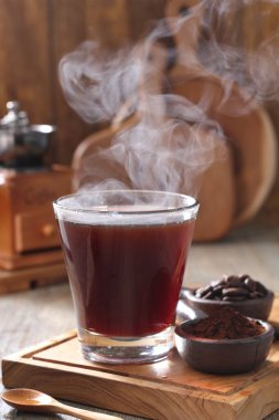 Coffee is a drink prepared from roasted coffee beans. Darkly colored, bitter, and slightly acidic, coffee has a stimulating effect on humans, primarily due to its caffeine content. It has the highest sales in the world market for hot drinks. 