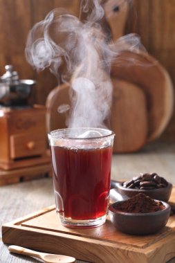 Coffee is a drink prepared from roasted coffee beans. Darkly colored, bitter, and slightly acidic, coffee has a stimulating effect on humans, primarily due to its caffeine content. It has the highest sales in the world market for hot drinks. 