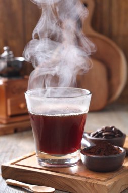 Coffee is a drink prepared from roasted coffee beans. Darkly colored, bitter, and slightly acidic, coffee has a stimulating effect on humans, primarily due to its caffeine content. It has the highest sales in the world market for hot drinks. 