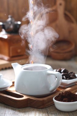 Coffee is a drink prepared from roasted coffee beans. Darkly colored, bitter, and slightly acidic, coffee has a stimulating effect on humans, primarily due to its caffeine content. It has the highest sales in the world market for hot drinks.