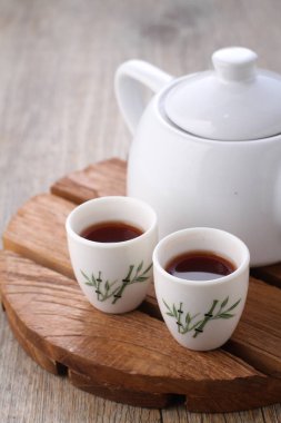 Tea is an aromatic beverage prepared by pouring hot or boiling water over cured or fresh leaves of Camellia sinensis, an evergreen shrub native to East Asia which probably originated in the borderlands of southwestern China and northern Myanmar.