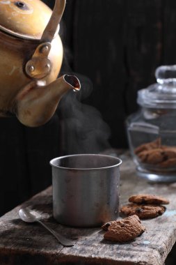 Tea is an aromatic beverage prepared by pouring hot or boiling water over cured or fresh leaves of Camellia sinensis, an evergreen shrub native to East Asia which probably originated in the borderlands of southwestern China and northern Myanmar. 