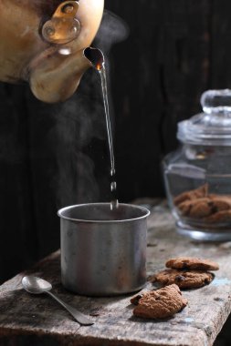 Tea is an aromatic beverage prepared by pouring hot or boiling water over cured or fresh leaves of Camellia sinensis, an evergreen shrub native to East Asia which probably originated in the borderlands of southwestern China and northern Myanmar. 