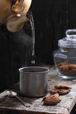 Tea is an aromatic beverage prepared by pouring hot or boiling water over cured or fresh leaves of Camellia sinensis, an evergreen shrub native to East Asia which probably originated in the borderlands of southwestern China and northern Myanmar. 