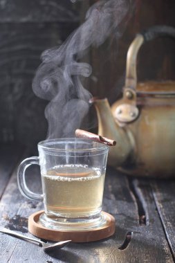 Tea is an aromatic beverage prepared by pouring hot or boiling water over cured or fresh leaves of Camellia sinensis, an evergreen shrub native to East Asia which probably originated in the borderlands of southwestern China and northern Myanmar. 