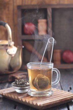Tea is an aromatic beverage prepared by pouring hot or boiling water over cured or fresh leaves of Camellia sinensis, an evergreen shrub native to East Asia which probably originated in the borderlands of southwestern China and northern Myanmar.