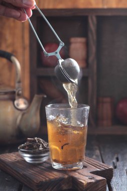 Tea is an aromatic beverage prepared by pouring hot or boiling water over cured or fresh leaves of Camellia sinensis, an evergreen shrub native to East Asia which probably originated in the borderlands of southwestern China and northern Myanmar.