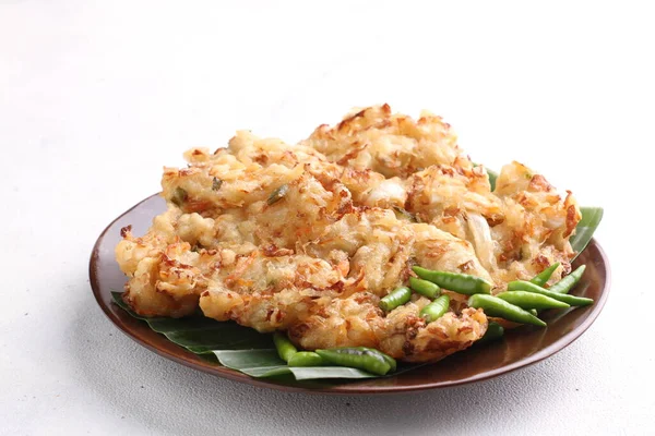 stock image Bakwan is a fried food made from vegetables and wheat flour that is commonly found in Indonesia. Bakwan usually refers to fried snacks of vegetables that are usually sold by traveling hawkers.