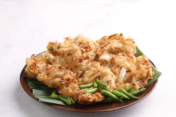 stock image Bakwan is a fried food made from vegetables and wheat flour that is commonly found in Indonesia. Bakwan usually refers to fried snacks of vegetables that are usually sold by traveling hawkers.