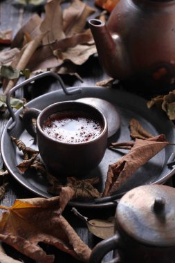 Tea is an aromatic beverage prepared by pouring hot or boiling water over cured or fresh leaves of Camellia sinensis, an evergreen shrub native to East Asia which probably originated in the borderlands of southwestern China and northern Myanmar.