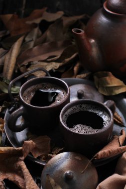 Tea is an aromatic beverage prepared by pouring hot or boiling water over cured or fresh leaves of Camellia sinensis, an evergreen shrub native to East Asia which probably originated in the borderlands of southwestern China and northern Myanmar.