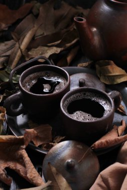 Tea is an aromatic beverage prepared by pouring hot or boiling water over cured or fresh leaves of Camellia sinensis, an evergreen shrub native to East Asia which probably originated in the borderlands of southwestern China and northern Myanmar.