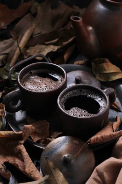 Tea is an aromatic beverage prepared by pouring hot or boiling water over cured or fresh leaves of Camellia sinensis, an evergreen shrub native to East Asia which probably originated in the borderlands of southwestern China and northern Myanmar.