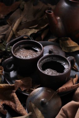 Tea is an aromatic beverage prepared by pouring hot or boiling water over cured or fresh leaves of Camellia sinensis, an evergreen shrub native to East Asia which probably originated in the borderlands of southwestern China and northern Myanmar.