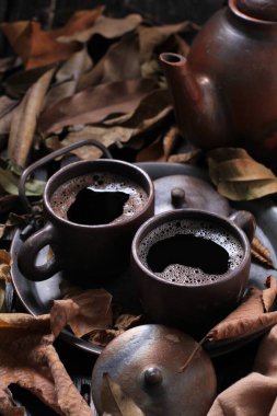 Tea is an aromatic beverage prepared by pouring hot or boiling water over cured or fresh leaves of Camellia sinensis, an evergreen shrub native to East Asia which probably originated in the borderlands of southwestern China and northern Myanmar.