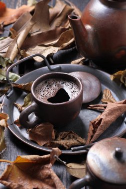 Tea is an aromatic beverage prepared by pouring hot or boiling water over cured or fresh leaves of Camellia sinensis, an evergreen shrub native to East Asia which probably originated in the borderlands of southwestern China and northern Myanmar.