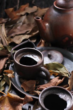 Tea is an aromatic beverage prepared by pouring hot or boiling water over cured or fresh leaves of Camellia sinensis, an evergreen shrub native to East Asia which probably originated in the borderlands of southwestern China and northern Myanmar.