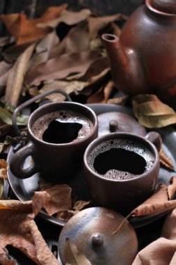 Tea is an aromatic beverage prepared by pouring hot or boiling water over cured or fresh leaves of Camellia sinensis, an evergreen shrub native to East Asia which probably originated in the borderlands of southwestern China and northern Myanmar.