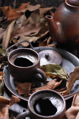 Tea is an aromatic beverage prepared by pouring hot or boiling water over cured or fresh leaves of Camellia sinensis, an evergreen shrub native to East Asia which probably originated in the borderlands of southwestern China and northern Myanmar.