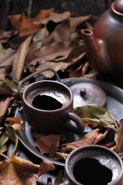 Tea is an aromatic beverage prepared by pouring hot or boiling water over cured or fresh leaves of Camellia sinensis, an evergreen shrub native to East Asia which probably originated in the borderlands of southwestern China and northern Myanmar.