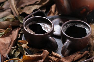 Tea is an aromatic beverage prepared by pouring hot or boiling water over cured or fresh leaves of Camellia sinensis, an evergreen shrub native to East Asia which probably originated in the borderlands of southwestern China and northern Myanmar.