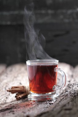 Tea is an aromatic beverage prepared by pouring hot or boiling water over cured or fresh leaves of Camellia sinensis, an evergreen shrub native to East Asia which probably originated in the borderlands of southwestern China and northern Myanmar.