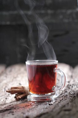 Tea is an aromatic beverage prepared by pouring hot or boiling water over cured or fresh leaves of Camellia sinensis, an evergreen shrub native to East Asia which probably originated in the borderlands of southwestern China and northern Myanmar.