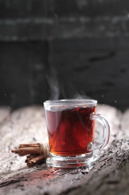 Tea is an aromatic beverage prepared by pouring hot or boiling water over cured or fresh leaves of Camellia sinensis, an evergreen shrub native to East Asia which probably originated in the borderlands of southwestern China and northern Myanmar.