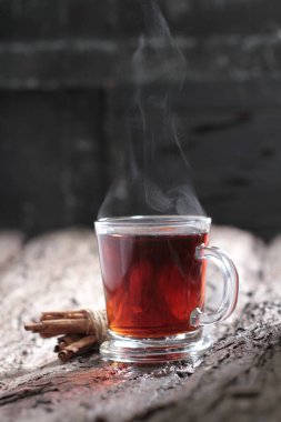 Tea is an aromatic beverage prepared by pouring hot or boiling water over cured or fresh leaves of Camellia sinensis, an evergreen shrub native to East Asia which probably originated in the borderlands of southwestern China and northern Myanmar.