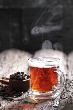 Tea is an aromatic beverage prepared by pouring hot or boiling water over cured or fresh leaves of Camellia sinensis, an evergreen shrub native to East Asia which probably originated in the borderlands of southwestern China and northern Myanmar.