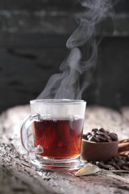 Tea is an aromatic beverage prepared by pouring hot or boiling water over cured or fresh leaves of Camellia sinensis, an evergreen shrub native to East Asia which probably originated in the borderlands of southwestern China and northern Myanmar.