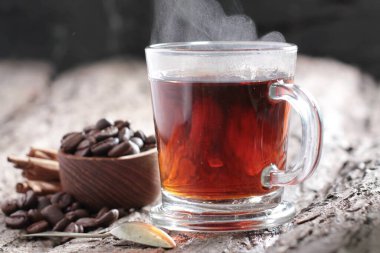 Tea is an aromatic beverage prepared by pouring hot or boiling water over cured or fresh leaves of Camellia sinensis, an evergreen shrub native to East Asia which probably originated in the borderlands of southwestern China and northern Myanmar.