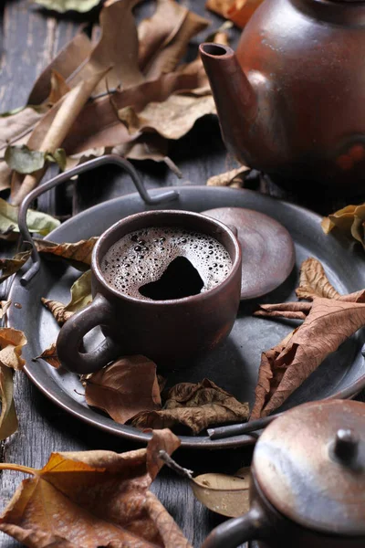 Tea is an aromatic beverage prepared by pouring hot or boiling water over cured or fresh leaves of Camellia sinensis, an evergreen shrub native to East Asia which probably originated in the borderlands of southwestern China and northern Myanmar.