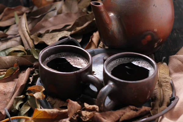 Tea is an aromatic beverage prepared by pouring hot or boiling water over cured or fresh leaves of Camellia sinensis, an evergreen shrub native to East Asia which probably originated in the borderlands of southwestern China and northern Myanmar.