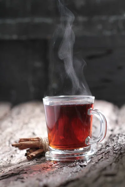 Tea is an aromatic beverage prepared by pouring hot or boiling water over cured or fresh leaves of Camellia sinensis, an evergreen shrub native to East Asia which probably originated in the borderlands of southwestern China and northern Myanmar.