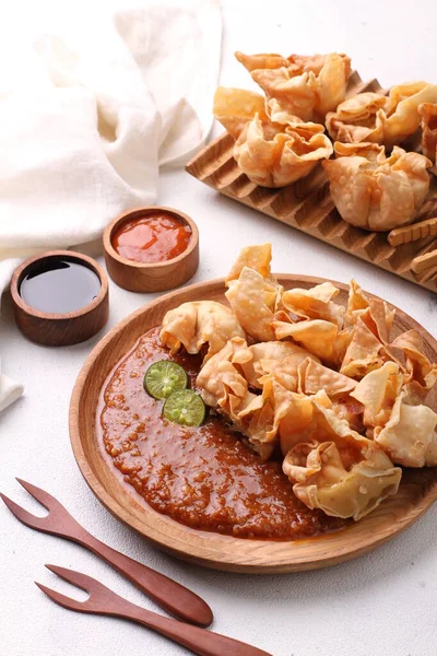 stock image Batagor is a Sundanese dish from Indonesia, and popular in Southeast Asia, consisting of fried fish dumplings, usually served with peanut sauce. It is traditionally made from minced tenggiri