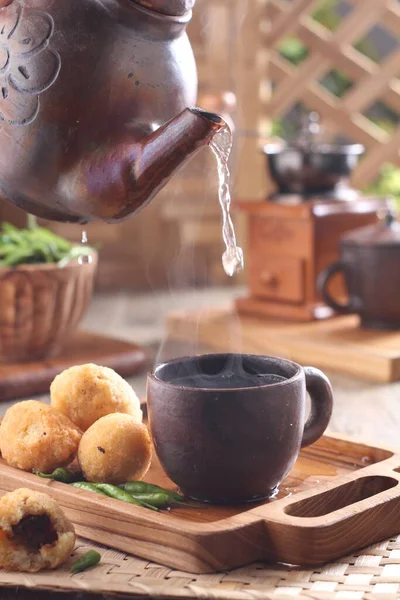 dinner table situation in the morning, a cup of hot tea with combro cake