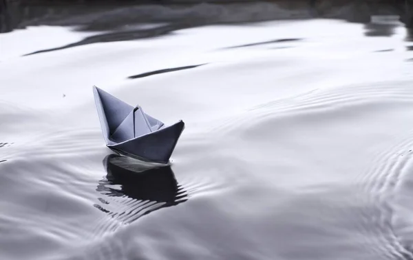 stock image Paper boat on the bumpy surface of the water