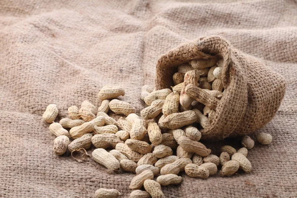 Amendoins Torrados Amêndoas Saco Serapilheira Fundo Comida Nutrição Saudável — Fotografia de Stock