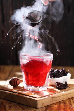 Tea is an aromatic beverage prepared by pouring hot or boiling water over cured or fresh leaves of Camellia sinensis, an evergreen shrub native to East Asia which probably originated in the borderlands of southwestern China and northern Myanmar