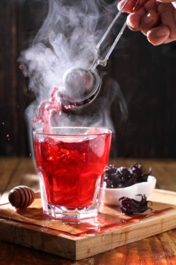 Tea is an aromatic beverage prepared by pouring hot or boiling water over cured or fresh leaves of Camellia sinensis, an evergreen shrub native to East Asia which probably originated in the borderlands of southwestern China and northern Myanmar.