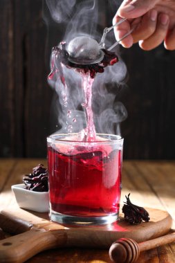 Tea is an aromatic beverage prepared by pouring hot or boiling water over cured or fresh leaves of Camellia sinensis, an evergreen shrub native to East Asia which probably originated in the borderlands of southwestern China and northern Myanmar.