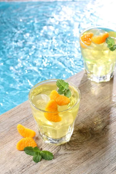 Ice oranges on the edge of the pool