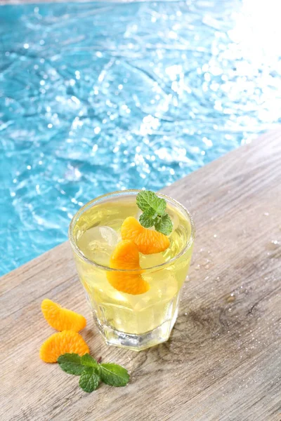 Ice oranges on the edge of the pool