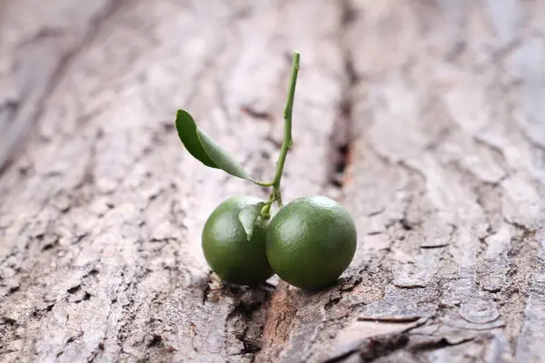 stock image close up of fresh green olives on wooden background 