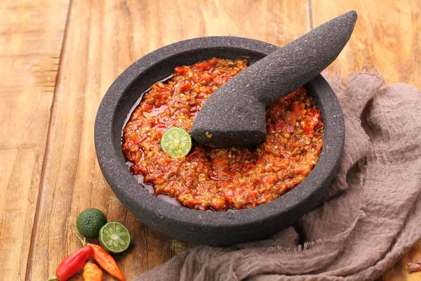 stock image red pepper and chili peppers on wooden background